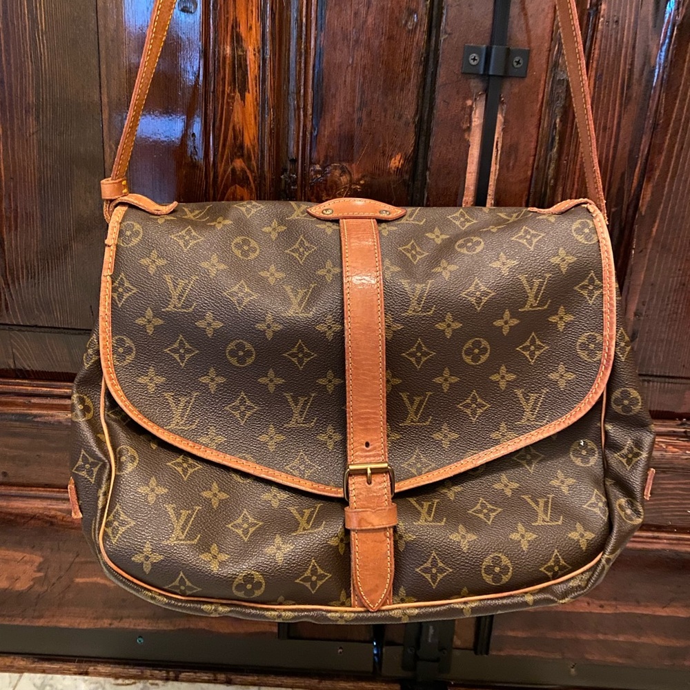 Authentic Louis Vuitton Saumur 2 sided crossbody.